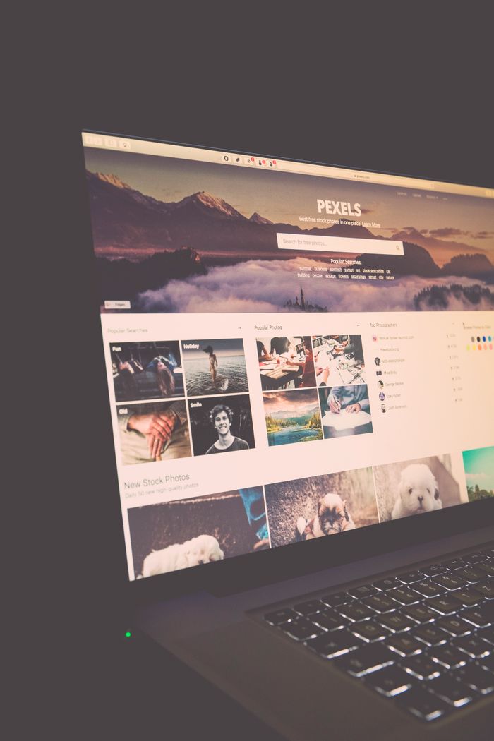 A laptop display showing the Pexels website, perfect for stock photo requirements.